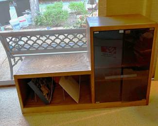 This is a bit tricky to see clearly here, but this is a small entertainment center with space for several electronic components and several LPs.