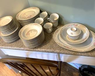 Another set of dishes can be seen on this corner desk.