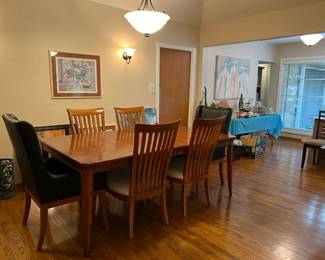 Here are two of the Thomasville black leather chairs, four of the matching chairs, and the dining table, all working together.