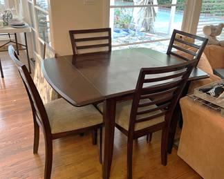 Here is a nice four-chair and breakfast table set, or use it in a small dining space. Your choice.