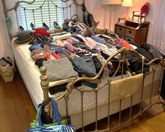 In case you thought the clothing selection was complete, oh ho, think again! The bed here shows off more. A couple of hats and more shoes are also here.