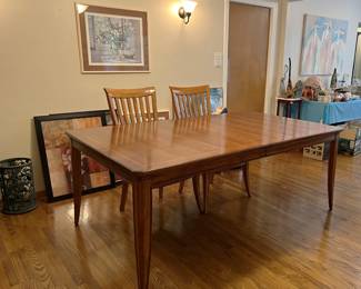 This photo is less tilted and shows a slightly different view of the dining table and chairs.