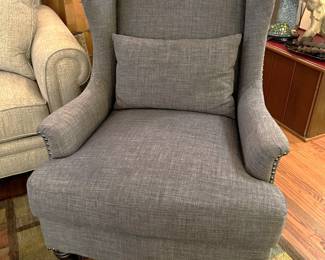 This high-backed overstuffed chair is in fine shape.