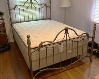 This queen-sized bed and bedframe is in good shape and has good style.