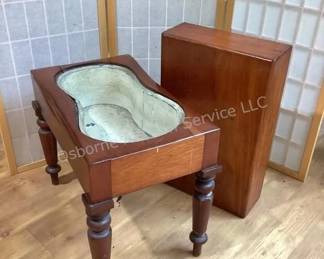 Primitive baby bath tub in stand