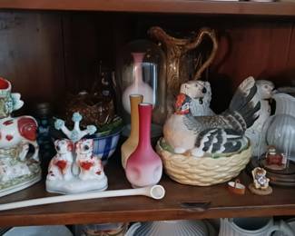 Nested Staffordshire Hen and other Staffordshire figurines.