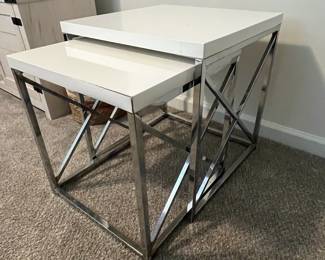 C23 - $50. Pair of Nesting Tables in good condition. One needs a little glue on an end (pictured). Largest Measures 19.5" Wide x 19.5" Deep x 21" tall. Smaller one 17.5" Wide x 17.5" Deep x 19" tall.