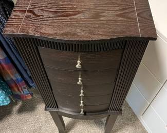 C35 - $65. Jewelry Armoire. Measures 14.5" Wide x 11" Deep x 39" Tall.