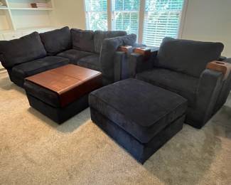 C19 - $3250. Lovesac "Sactional" Midnight Blue. 6 seat - 8 Side Modular Sectional in excellent condition. 1 Charge Side. Lovesac pillows and blankets included. Includes 2 tables & 3 cup holders. Each module measures 35" Wide x 29" Deep seats Measure 35" x 35". (This retails for over 6k)