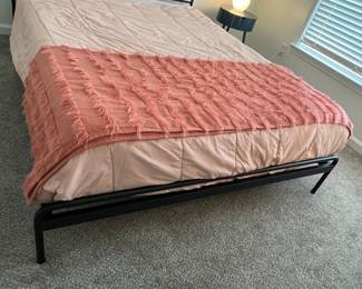C25 - $250. Queen, Black Metal Framed Bed. In good condition. From Ashley Furniture. Clean Queen Mattress included if you want it! 2021 Mattress - very gently used.