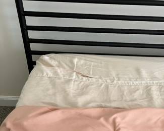 C25 - $250. Queen, Black Metal Framed Bed. In good condition. From Ashley Furniture. Clean Queen Mattress included if you want it! 2021 Mattress - very gently used.