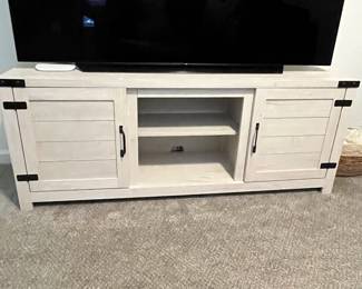 C20 - $65. Cream color Shaker TV Stand in great shape. Measures 60" Wide x 28" Deep x 30.5" Tall.