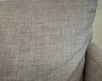 C10 - $650. Crate & Barrel Gray Loveseat. This is in very good condition. Measures 76.5" Wide x 18.5" Deep x 29" Tall. Fabric : Galaxy Ash (Retails for $1399.)