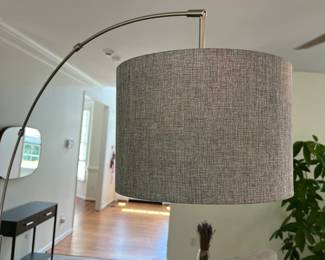 C12 - $65. Arc Lamp with Marble Base Measures 76" Tall, base 11" Round. This unique lamp is in great condition.