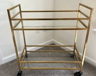C6 - $50. Brass Bar Cart in great condition. Measures 28.5" wide x 14.5" deep x 31" tall. (Retails for $100.)
