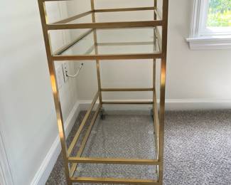 C6 - $50. Brass Bar Cart in great condition. Measures 28.5" wide x 14.5" deep x 31" tall. (Retails for $100.)