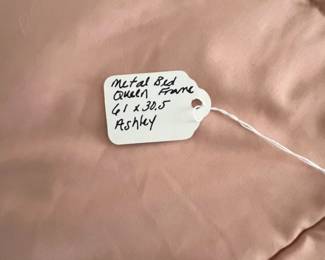 C25 - $250. Queen, Black Metal Framed Bed. In good condition. From Ashley Furniture. Clean Queen Mattress included if you want it! 2021 Mattress - very gently used.