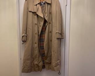 D25 - $250. Burberry Trench Coat with wool liner. No size tag - looks like a large.