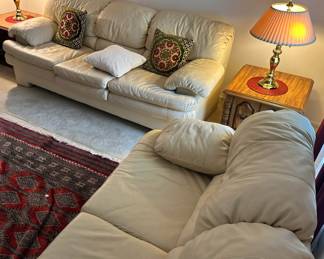 D3 - $450 SET. Ivory Leather couch 85"36"34" and loveseat 65"x33"x37". Good condition. No rips or holes.