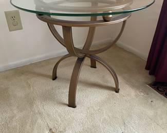 D8 - $45. Round glass and metal side table. 26"round 21"tall.