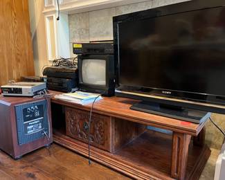 Coffee table, TVs, VHS players, DVD players