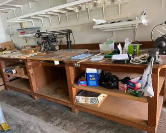 Large wood working cutting station with electrical outlets with Sears Craftsman Cutting Table Saw attached