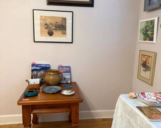 One of a pair of end tables, various Florida inspired art and pottery