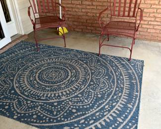 outdoor rug, wrought iron chairs