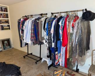 Racks and closets filled with women's and men's clothing
