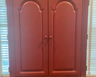 Painted armoire used as entertainment center