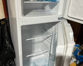medium height about 5 feet clean inside white enamel outside finish refrigerator freezer works