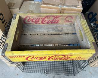 Drink Coca-Cola in bottles carrying box