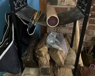 Real stack of chopped firewood for a magnificent fireplace.& the iron rack