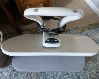 I love this a singer garment ironing board for use on any counter surface or table top. I love it Never have another wrinkled shirt again.
