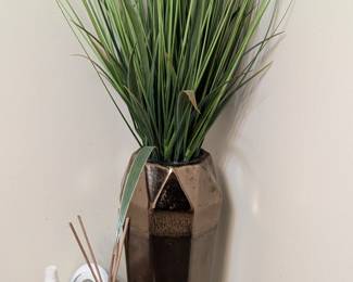 Vase with artificial greenery