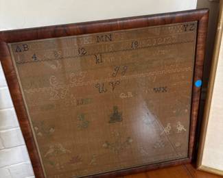 framed Needlework sampler