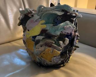 decorative vase or planter with an intricate design of marine life 