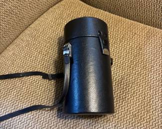 vintage camera lens in a hard case 