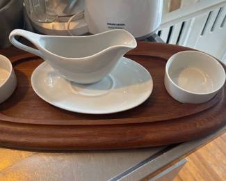 white ceramic gravy boat and two small bowls 