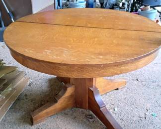 Round oak table with pedestal base