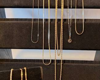 Gold Tennis Bracelet, 5 Necklaces And a set of pierced Earrings