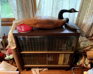 Books, bookcase, large wooden duck