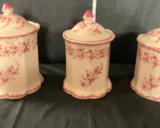 A Set of Ceramic Cracker Barrel Red Floral Canisters with Lids