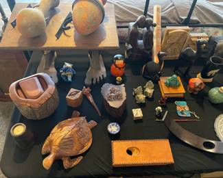 Table full of unique and vintage collectibles. 