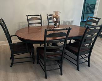 Dining Room Table with six chairs, has two leafs.
