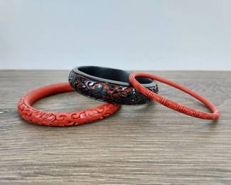 Lot 789: Collection of Three Vintage Chinese Carved Cinnabar Lacquer Bangle Bracelets