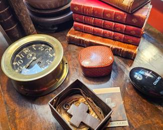 Jan Barboglio, beautiful old leather books, US Navy deck clock (showcase)