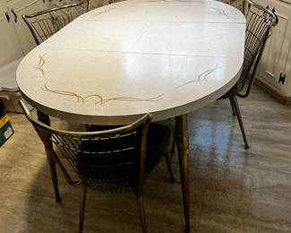 #62 vintage laminate white and gold round table with 1 leaf inside 4 chairs 42x60x29 $120.00