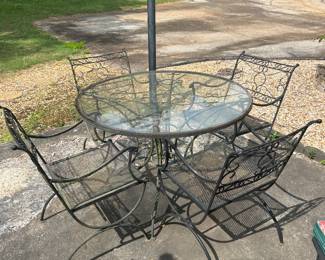 Wrought Iron patio set with 4 chairs and glass top