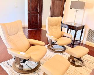 pair of cream leather Copenhagen swivel chairs